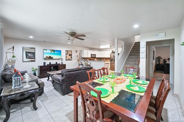 8011 Sumal Cir, Baytown, TX 77521 - dining area with light tile patterned floors, stairway, a ceiling fan, and recessed lighting