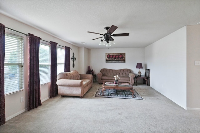 8011 Sumal Cir, Baytown, TX 77521 - carpeted living area featuring ceiling fan, plenty of natural light, and a textured ceiling