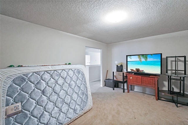 8011 Sumal Cir, Baytown, TX 77521 - bedroom featuring light colored carpet and a textured ceiling
