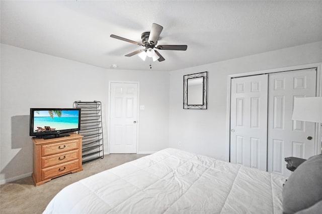 8011 Sumal Cir, Baytown, TX 77521 - bedroom with light colored carpet, a closet, and ceiling fan