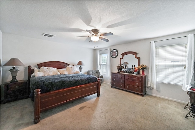 8011 Sumal Cir, Baytown, TX 77521 - bedroom with carpet, a ceiling fan, and a textured ceiling
