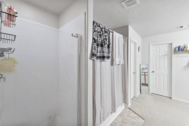 8011 Sumal Cir, Baytown, TX 77521 - full bathroom with a shower stall and a textured ceiling