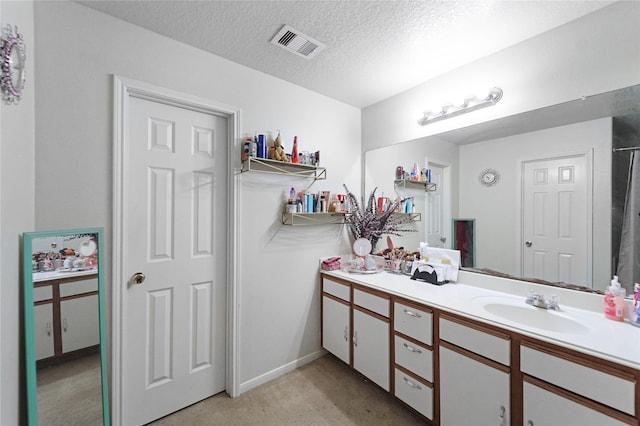 8011 Sumal Cir, Baytown, TX 77521 - bathroom with vanity and a textured ceiling