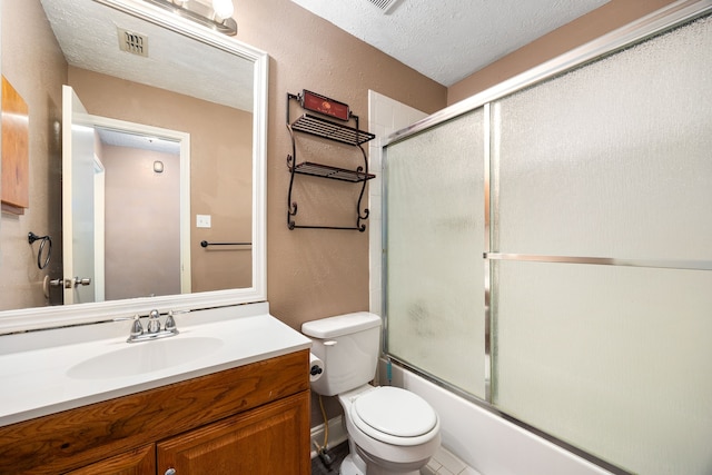 12226 Westwold Dr, Tomball, TX 77377 - bathroom with vanity, bath / shower combo with glass door, a textured ceiling, and a textured wall