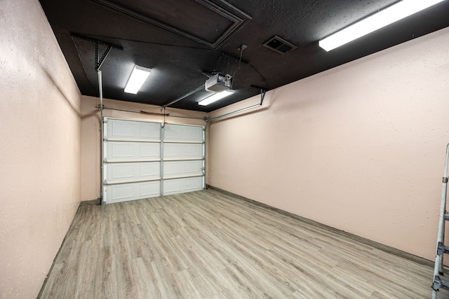 12226 Westwold Dr, Tomball, TX 77377 - garage featuring a garage door opener