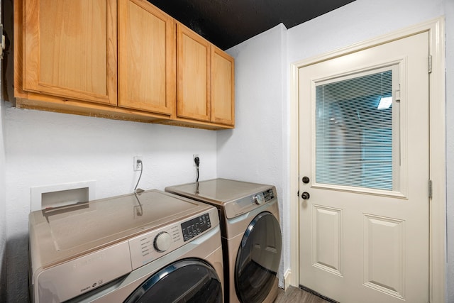12226 Westwold Dr, Tomball, TX 77377 - washroom featuring cabinet space and washing machine and clothes dryer