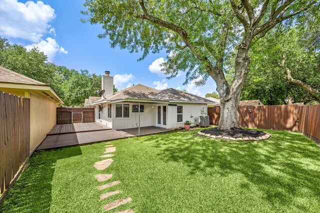 12226 Westwold Dr, Tomball, TX 77377 - back of house featuring a fenced backyard, a chimney, a deck, and french doors