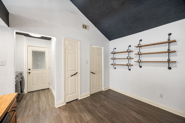 12226 Westwold Dr, Tomball, TX 77377 - spare room featuring washer and dryer, wood finished floors, and lofted ceiling