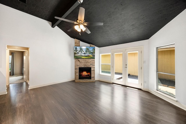 12226 Westwold Dr, Tomball, TX 77377 - unfurnished living room featuring wood finished floors, french doors, a ceiling fan, and a brick fireplace