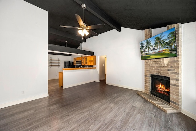 12226 Westwold Dr, Tomball, TX 77377 - unfurnished living room featuring wood finished floors, a brick fireplace, and a ceiling fan