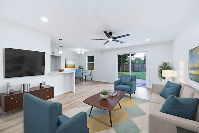 5730 Alvarado Dr, Houston, TX 77035 - living area featuring light wood finished floors, ceiling fan, and recessed lighting