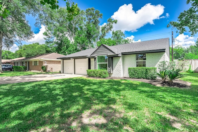 5730 Alvarado Dr, Houston, TX 77035 - view of front of house with a garage, brick siding, a front yard, driveway, and a shingled roof