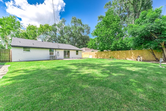 5730 Alvarado Dr, Houston, TX 77035 - back of house with brick siding, a fenced backyard, and a patio