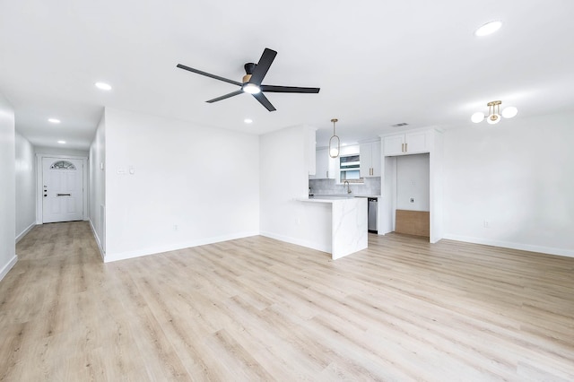 5730 Alvarado Dr, Houston, TX 77035 - unfurnished living room featuring ceiling fan, recessed lighting, and light wood finished floors