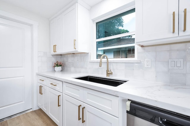 5730 Alvarado Dr, Houston, TX 77035 - kitchen with dishwasher, decorative backsplash, white cabinets, and light stone counters