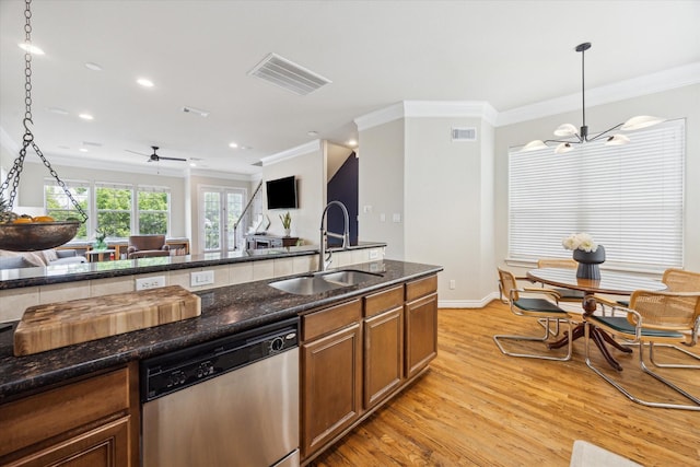 1219 Hickory St, Houston, TX 77007 - kitchen featuring stainless steel dishwasher, crown molding, a chandelier, open floor plan, and light wood-type flooring