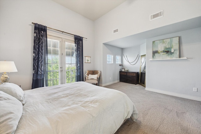1219 Hickory St, Houston, TX 77007 - carpeted bedroom with access to exterior and baseboards