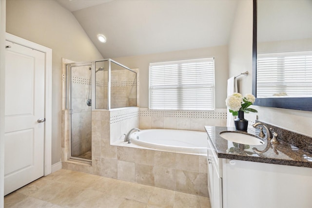 1219 Hickory St, Houston, TX 77007 - full bathroom with vaulted ceiling, a bath, vanity, a stall shower, and tile patterned floors