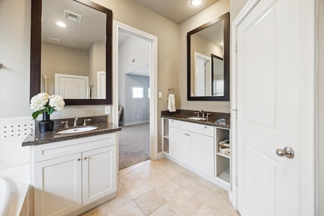 1219 Hickory St, Houston, TX 77007 - bathroom with two vanities and tile patterned floors