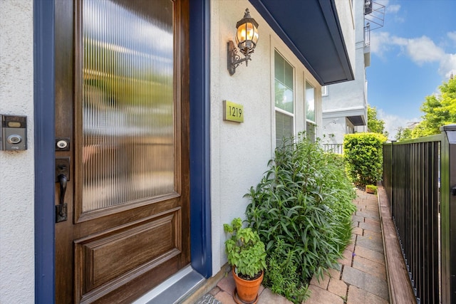 1219 Hickory St, Houston, TX 77007 - property entrance featuring stucco siding and a porch