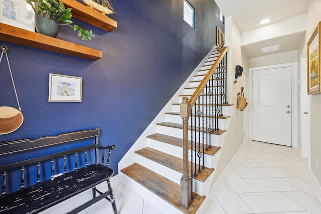 1219 Hickory St, Houston, TX 77007 - staircase featuring baseboards and recessed lighting