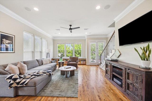 1219 Hickory St, Houston, TX 77007 - living area featuring light wood-style floors, ceiling fan, recessed lighting, ornamental molding, and stairs