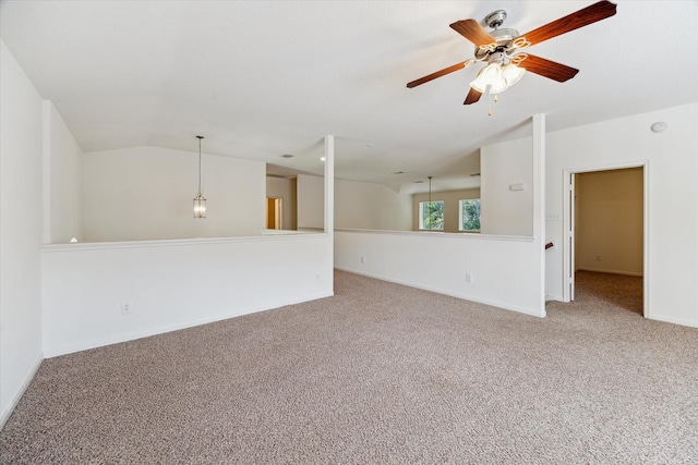 15 Sheltered Arbor Ct, The Woodlands, TX 77382 - unfurnished living room with carpet floors, ceiling fan, and vaulted ceiling