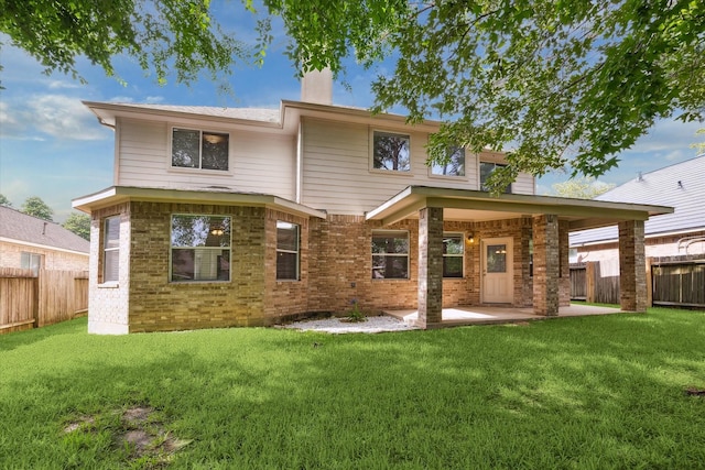 15 Sheltered Arbor Ct, The Woodlands, TX 77382 - rear view of house with a patio area, a fenced backyard, and brick siding