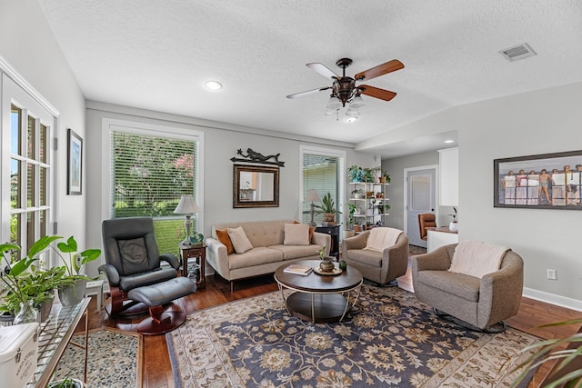 8639 Ballinger Dr, Houston, TX 77064 - living area with wood finished floors, ceiling fan, healthy amount of natural light, a textured ceiling, and vaulted ceiling