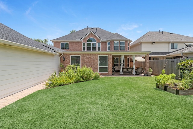 8639 Ballinger Dr, Houston, TX 77064 - back of house with brick siding, a vegetable garden, and a patio