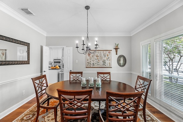 8639 Ballinger Dr, Houston, TX 77064 - dining space featuring dark wood-type flooring, ornamental molding, and a chandelier