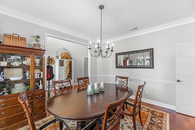 8639 Ballinger Dr, Houston, TX 77064 - dining space featuring ornamental molding, wood finished floors, and a chandelier