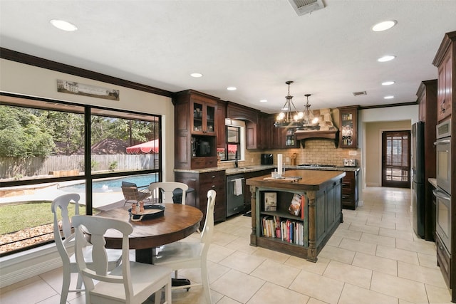 1025 Creek Bnd, Jasper, TX 75951 - kitchen featuring range hood, dishwashing machine, ornamental molding, gas stovetop, and a kitchen island