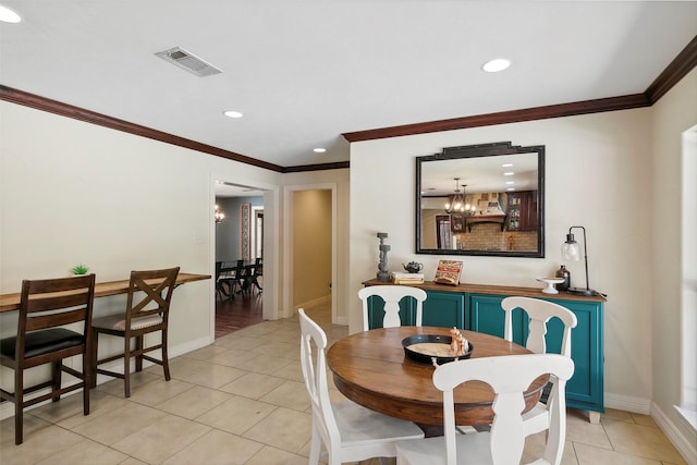 1025 Creek Bnd, Jasper, TX 75951 - dining room featuring light tile patterned floors, ornamental molding, recessed lighting, and a chandelier