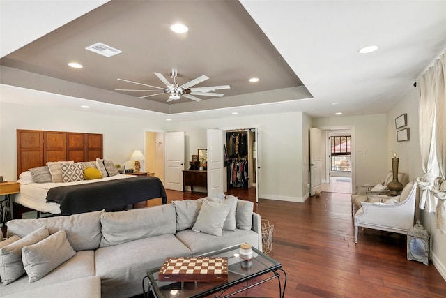 1025 Creek Bnd, Jasper, TX 75951 - bedroom featuring a raised ceiling, recessed lighting, dark wood finished floors, a closet, and a spacious closet