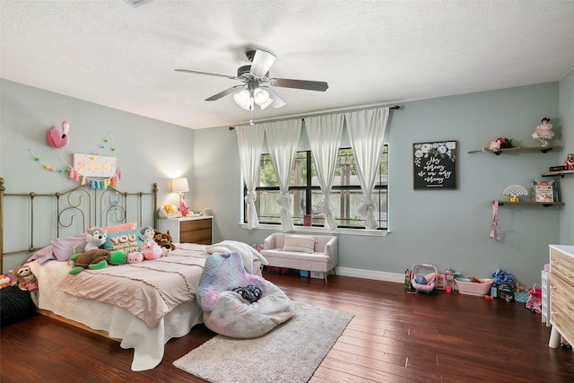1025 Creek Bnd, Jasper, TX 75951 - bedroom with hardwood / wood-style flooring, ceiling fan, and a textured ceiling