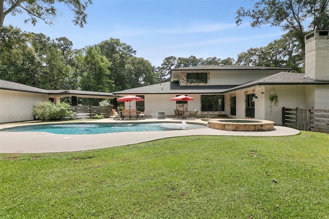 1025 Creek Bnd, Jasper, TX 75951 - view of swimming pool with a patio area, a pool with connected hot tub, and outdoor dining space