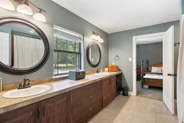 1025 Creek Bnd, Jasper, TX 75951 - ensuite bathroom featuring double vanity and tile patterned flooring