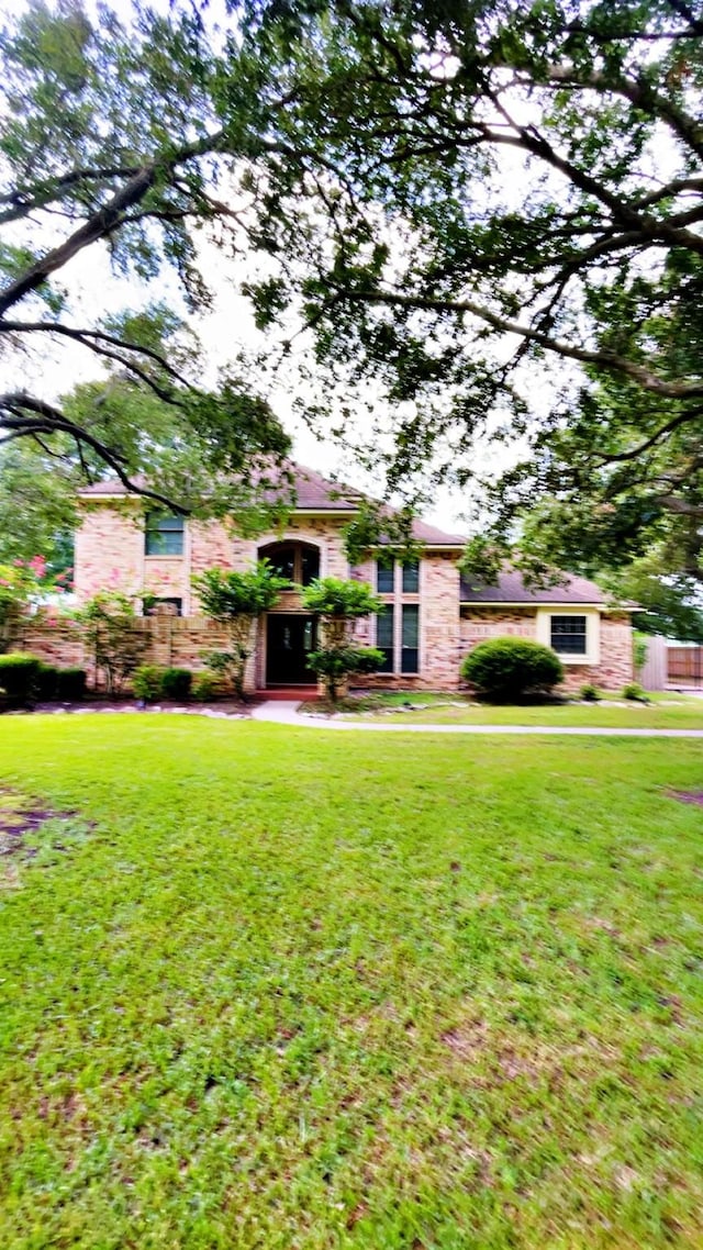 1600 Azalea St, Sweeny, TX 77480 - view of front of home with a front lawn