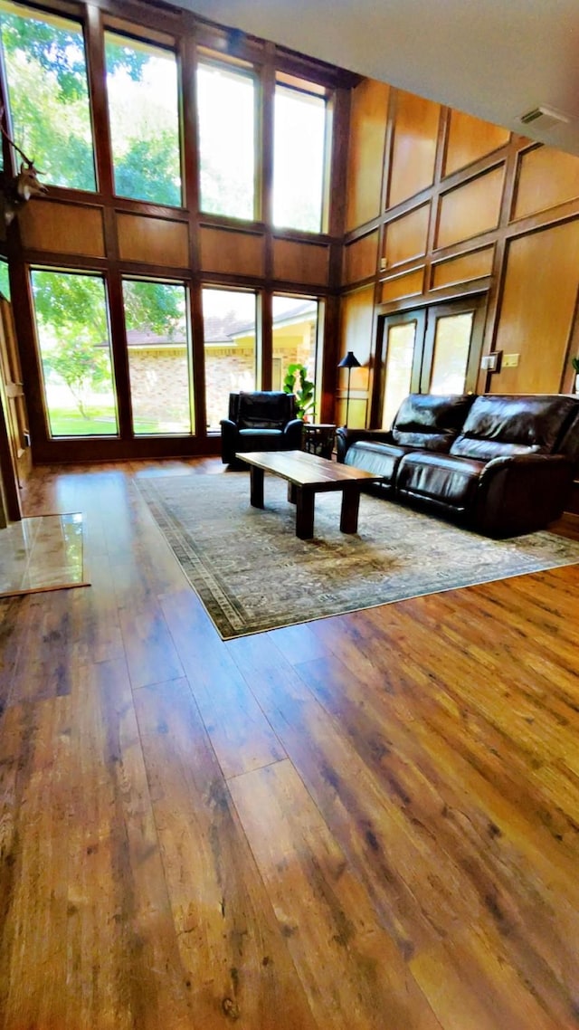 1600 Azalea St, Sweeny, TX 77480 - living area featuring a towering ceiling and hardwood / wood-style flooring