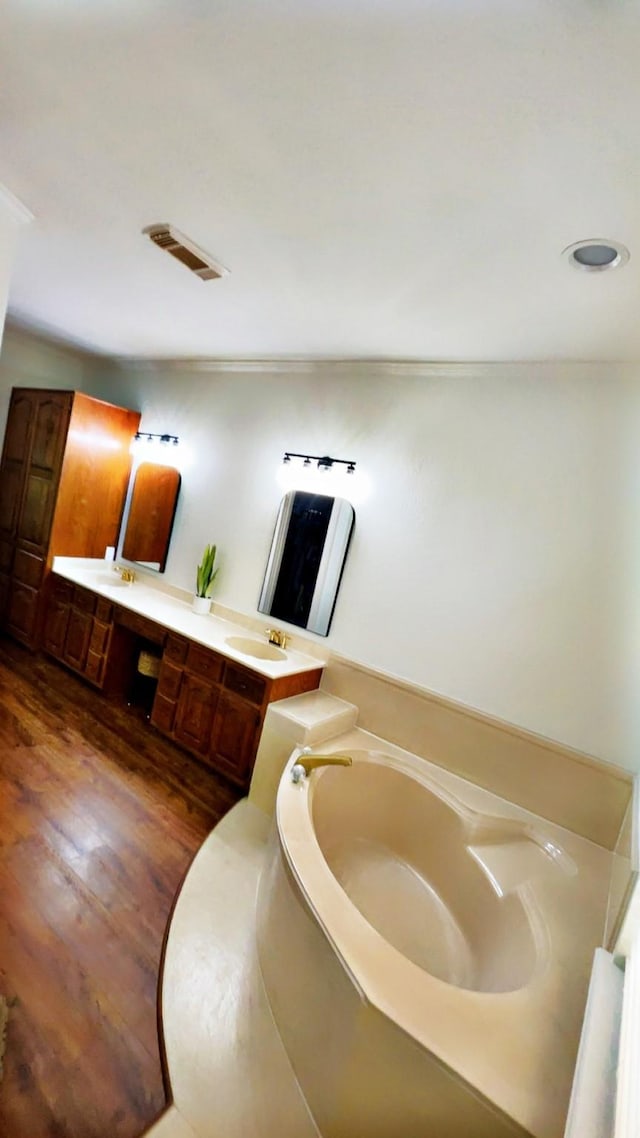 1600 Azalea St, Sweeny, TX 77480 - bathroom featuring a bath, double vanity, and wood finished floors