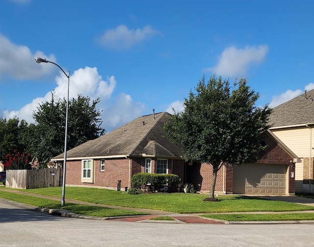 3514 Tulip Trace Dr, Spring, TX 77386 - view of front of property featuring brick siding, asphalt driveway, and an attached garage