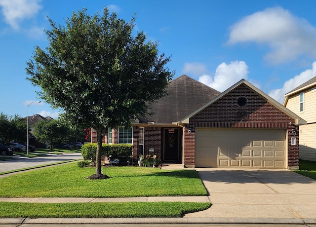 3514 Tulip Trace Dr, Spring, TX 77386 - view of front of home with an attached garage, brick siding, driveway, a front yard, and roof with shingles