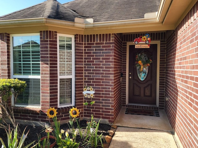 3514 Tulip Trace Dr, Spring, TX 77386 - view of exterior entry with brick siding and roof with shingles