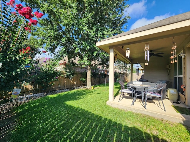 3514 Tulip Trace Dr, Spring, TX 77386 - fenced backyard with ceiling fan and a patio area