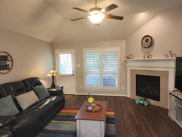 3514 Tulip Trace Dr, Spring, TX 77386 - living area featuring ceiling fan, dark wood-style flooring, a tiled fireplace, and vaulted ceiling