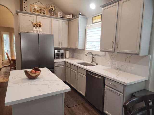 3514 Tulip Trace Dr, Spring, TX 77386 - kitchen with appliances with stainless steel finishes, gray cabinets, dark wood-style flooring, a kitchen island, and vaulted ceiling