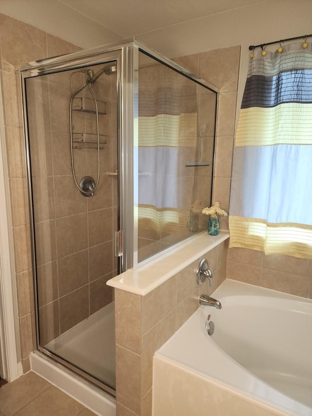 3514 Tulip Trace Dr, Spring, TX 77386 - bathroom featuring a shower stall, a bath, and tile patterned flooring