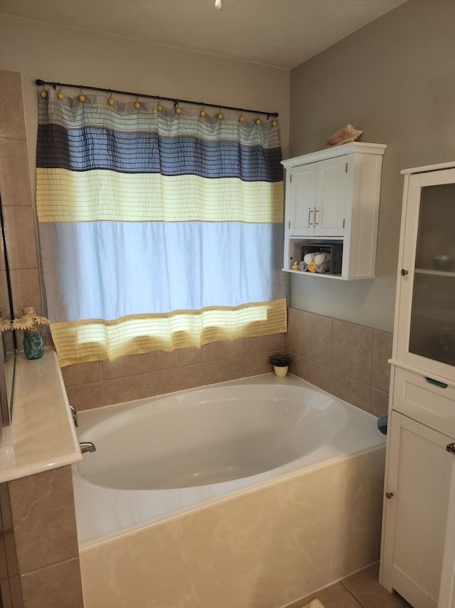 3514 Tulip Trace Dr, Spring, TX 77386 - bathroom featuring a bath and tile patterned floors