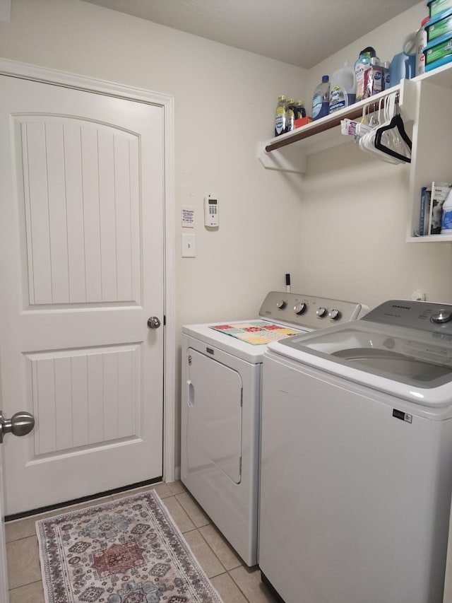 3514 Tulip Trace Dr, Spring, TX 77386 - washroom featuring separate washer and dryer and light tile patterned flooring